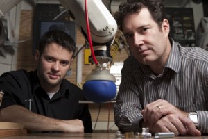 John Amend and Hod Lipson with the robot hand. Photo by Robert Barker, University Photography, via the Cornell Chronicle Online.